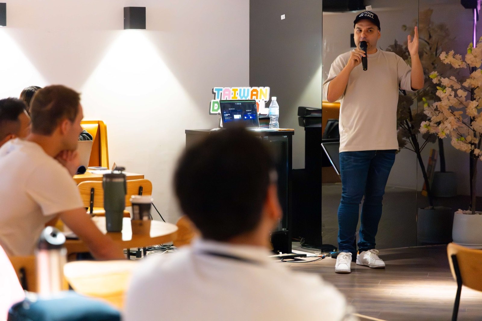 Ruben presenting to a seated audience in Taiwan